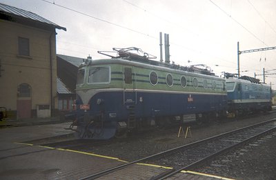 Striking image of a Swiss Federal Railways (SBB) electric locomotive, likely an Ae 4/7 series, detailed with green and blue l...