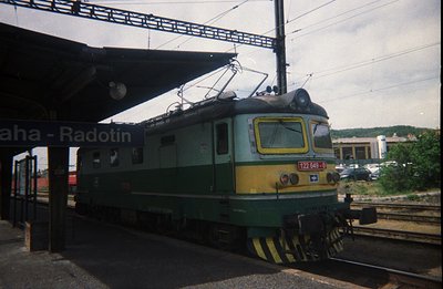 Bulgarian State Railways electric locomotive (type 122, number 049) at Radotin station. Likely captured in the 1970s-80s give...