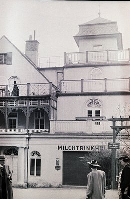 Exterior view of "Milchtrinkhalle" (milk drinking hall), a neoclassical building featuring prominent arched windows & ornate ...