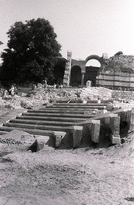 Stone staircase ascends to the ruins of a monumental structure, likely a palace or temple. The architecture suggests Mughal o...