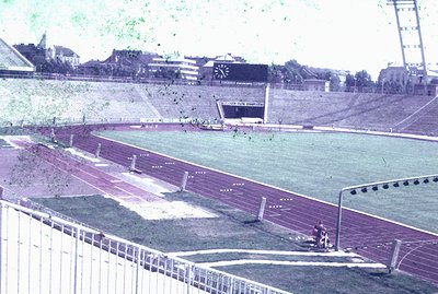 A wide view of a track and field stadium, likely intended for athletics or a similar sporting event. Visible are the running ...