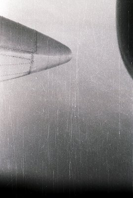 Close-up, black and white photograph of an aircraft nose section. Visible panel lines and rivets suggest a mid-century jet ai...