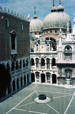 A bird's-eye view of the Doge's Palace courtyard in Venice, Italy. Elaborate Renaissance architecture features arcades and tw...