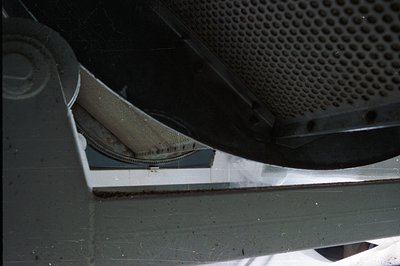 Industrial ventilation system detail showing a curved metal duct with perforated screen. Visible are structural supports and ...
