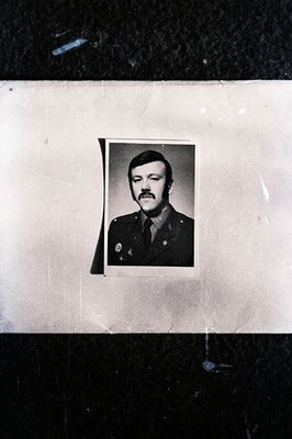 Formal portrait of a man in military uniform, featuring a prominent mustache and neatly styled hair. Likely a service or pers...