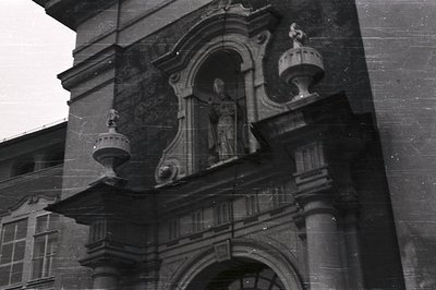 Ornate stone archway & statuary, likely part of a European ecclesiastical building. Detailed carvings exemplify Baroque or Ro...