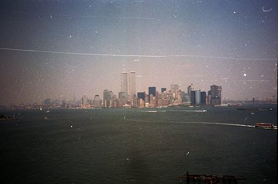 Exterior view of the Manhattan skyline, featuring the iconic World Trade Center towers. Visible across the water, with a slig...
