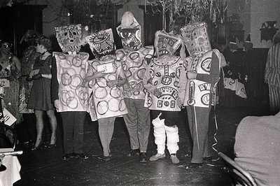 Group of children in elaborate, geometric-patterned costumes resembling futuristic or alien-themed outfits, likely from a 196...