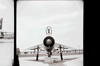 Striking view of a Soviet-era Mikoyan-Gurevich MiG-25 Foxbat fighter jet on static display. Large engine nozzle dominates the...