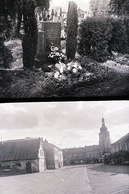 Okay, here are two descriptions following the requested format: **Image 1 (Cemetery)** Monochrome image shows a weathered gra...