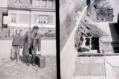 Here's a description of the image, following your provided guidelines: A man and boy walk along a grassy path, the man carryi...