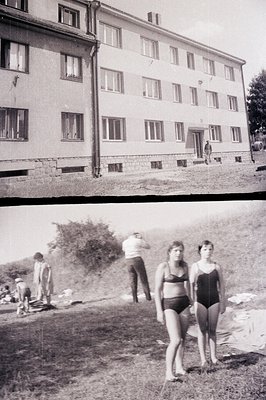 **Image 1:** A three-story, concrete apartment building, likely social housing, dominates the view. Simple window designs and...