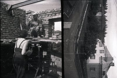 Construction workers build a brick wall, one perched atop a wooden scaffold. Detail shows bricklaying techniques, traditional...