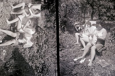 Black and white candid captures a group of young women relaxing outdoors, likely in a garden or park setting. They appear to ...