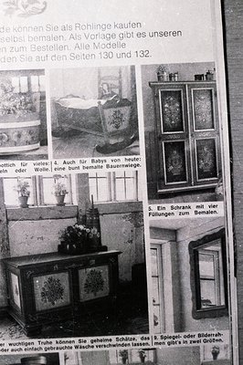 Black and white advertisement showcases handcrafted wooden dollhouse furniture, likely from a catalog. Featured items include...
