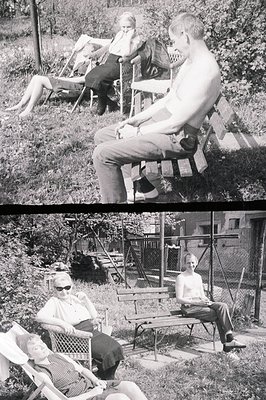 A monochrome image depicts a young, shirtless man seated on a wooden bench in a grassy, likely backyard setting. Two women ar...