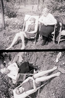 Two women relax in wicker chairs amidst lush greenery, possibly a garden or park setting. The elder woman wears a dark skirt ...