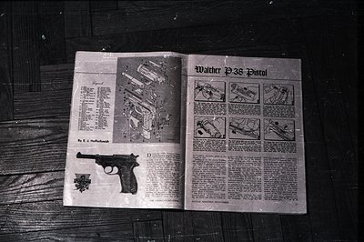 Technical illustration of a Walther P38 pistol, spread across two pages. Diagrammatic exploded view showcases internal compon...