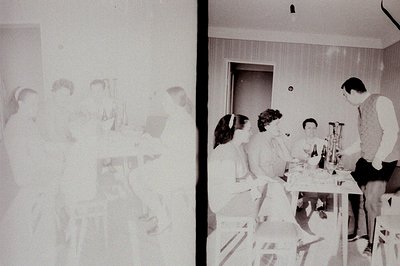 Here's a description of the photograph, following the specified format: A blurred, ghostly image overlays a clearer scene of ...