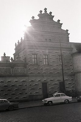 Ornate, black & white photo showcases a building with intricate sgraffito facade ornamentation. Likely Central/Eastern Europe...