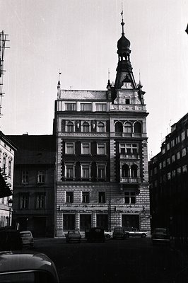 Ornate, multi-story building featuring a central tower with a copper dome, indicative of late 19th/early 20th century archite...