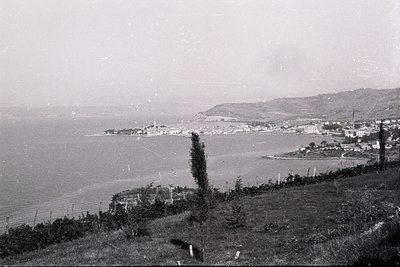 A sweeping view of Varna, Bulgaria, captured circa 1960s. The image shows a coastal cityscape with a prominent mosque dome, r...