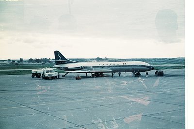 Vintage **SABENA** Concorde prototype (or early supersonic jet) on tarmac, likely **1960s–1970s**. Ground crew in white unifo...
