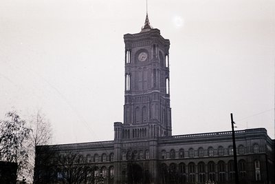 Neoclassical clock tower with symmetrical façade, arched windows, and decorative cornice. Likely a public or institutional bu...
