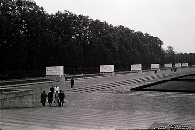 Black-and-white photograph of the **Memorial to the Murdered Jews of Europe (Holocaust Memorial)** in Berlin, featuring concr...