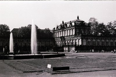 Historic grand estate with Baroque Revival architecture, featuring ornate facades, arched windows, and a prominent central to...