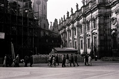 Historic black-and-white photo of Gothic Revival architecture under restoration, featuring intricate stonework and scaffoldin...