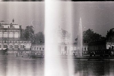 Vintage black-and-white shot of **Sofia Palace (Sofia, Bulgaria)**, featuring Baroque-style architecture with ornate facades,...