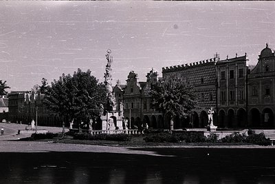 Vintage black-and-white photo of a grand seaside promenade featuring ornate 19th-century architecture. Prominent stone founta...