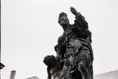 Bronze equestrian statue of a figure in dynamic pose, raising right arm. Detailed drapery and horse musculature visible. Like...