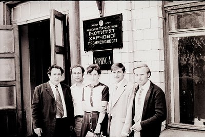 Group portrait outside Kyiv Technological Institute of Food Industry (Kiev, USSR), 1960s–1970s. Five individuals in formal at...