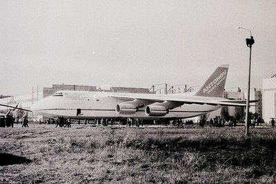Antonov An-225 Mriya cargo aircraft on display, likely at an airshow or exhibition. Crowd gathered around, indicating public ...