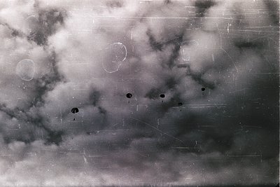 Vintage black-and-white aerial photo showing circular crop fields with distinct plow marks. Likely mid-20th century agricultu...