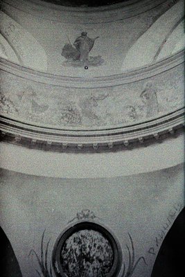 Neoclassical fresco depicting a seated figure in a domed ceiling, surrounded by floral and geometric motifs. The fresco featu...
