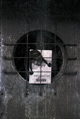Vintage Soviet-era poster fragment featuring a skier in mid-dynamic pose, framed in a circular window. Text reads "Про олимпи...