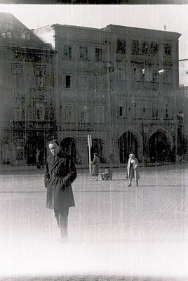 Vintage monochrome reflection of a grand, multi-story building with arched windows and balconies, likely a European seaside h...