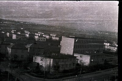 Aerial view of Soviet-era residential blocks, likely 1960s–1980s. Uniform concrete panel construction with flat roofs and min...