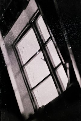 Close-up of a vintage glass block window with visible handwriting on the interior surface, likely a mid-20th century design. ...