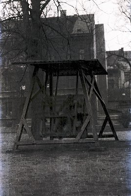 Vintage metal guard booth with sloped roof, likely a 20th-century traffic or security structure. Concrete base and weathered ...