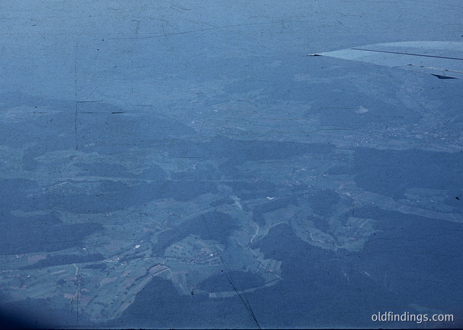 Aerial view of a coastal salt evaporation pond system, likely for industrial salt harvesting. The geometric, shallow pools create a striking pattern of light and shadow. The arrangement suggests a mid-20th century design, possibly or . The coastal location and layout resemble ’s or similar Mediterranean salt flats.