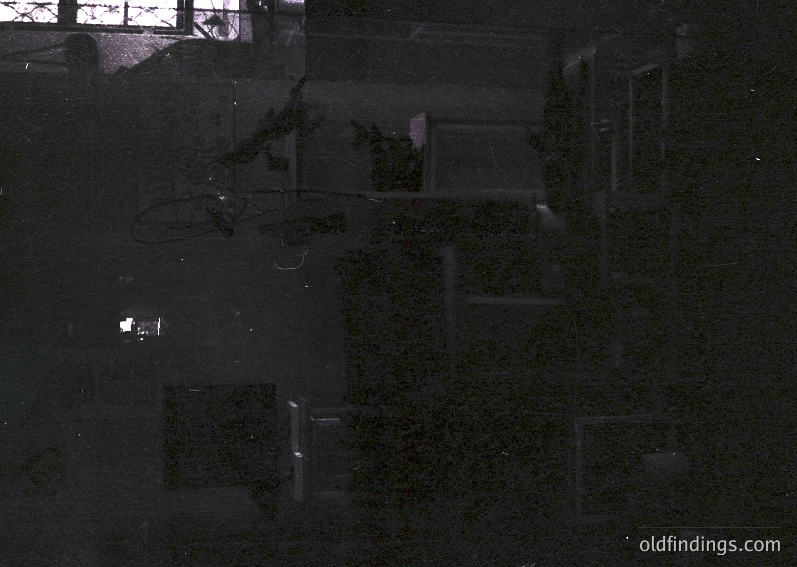 Aerial view of a geometric, grid-patterned courtyard with manicured shrubs forming rectangular shapes. Likely a public or institutional complex, possibly from the mid-20th century. The symmetry suggests architectural planning for efficiency or aesthetics.