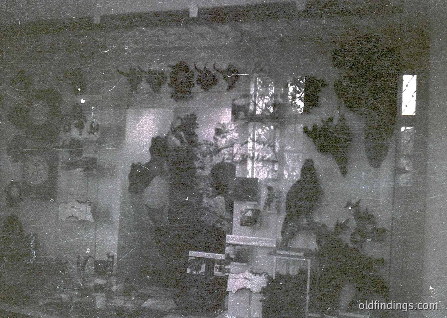 Aerial black-and-white photo of a densely built urban area with grid-like streets and clustered buildings, likely from the mid-20th century. Visible are rectangular plots, small green spaces, and a mix of residential and institutional structures. The image suggests a planned city layout, possibly Eastern European.