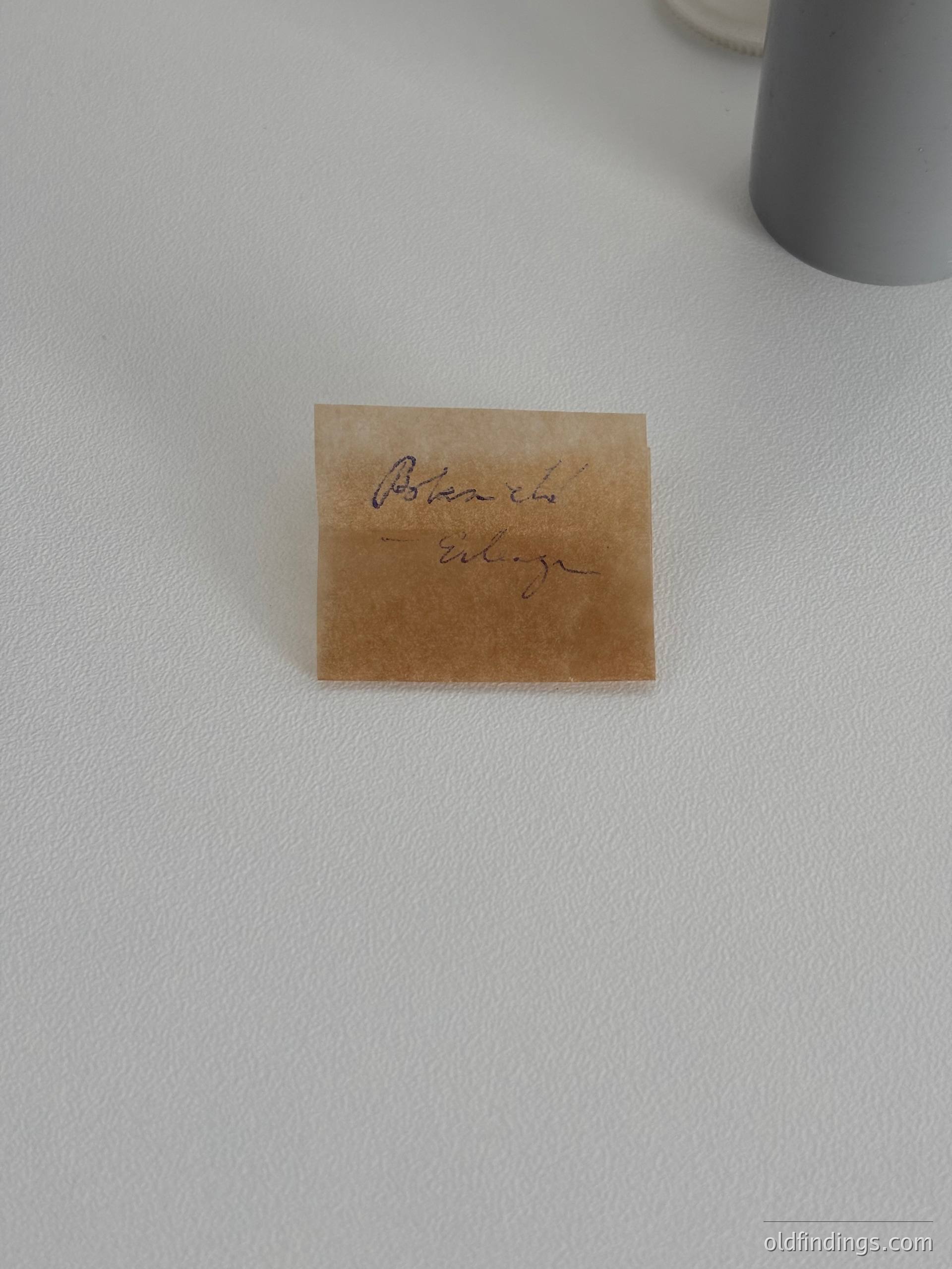 Vintage handwritten note card with inked text "Boston, Mass." on aged brown paper, likely 20th-century American ephemera. Ideal for historical research or nostalgic design references.
