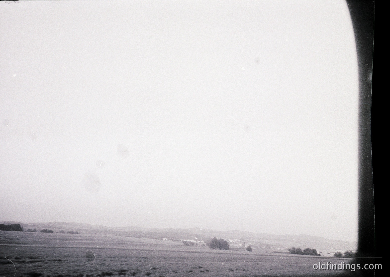 Vintage black-and-white aerial view of flat, open terrain with sparse vegetation and faintly visible tree clusters. Likely captured mid-20th century for agricultural or cartographic purposes.