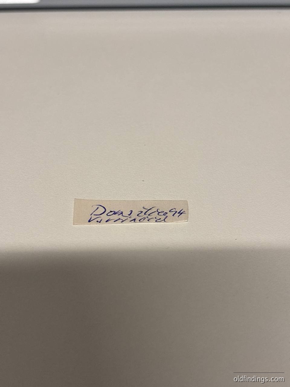 Close-up of a handwritten label on a plain surface: "Don 2004 Varna." Likely a vintage or archival tag from Bulgaria’s Black Sea port city. Useful for historical research or local studies.