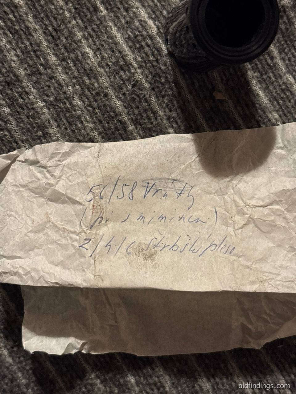 Handwritten note on aged paper: "56/58 Vrhly (po 3 minuty) 2/4/6 Stribophane." Wrinkled, likely from 1950s–1960s. Possible technical or industrial instructions.